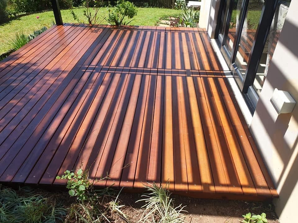 Gist Nail It’s completed timber deck opening onto a green garden