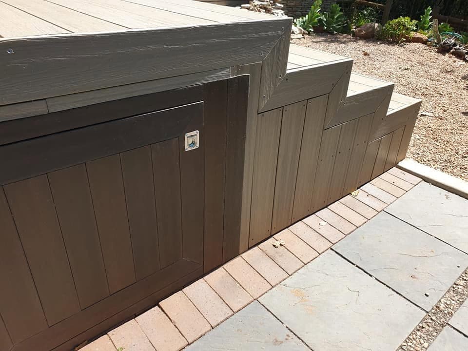 Finished decking fascia and steps with an access hatch
